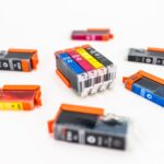 Close-up shot of a CMYK ink cartridges for a color printer isolated on a white background. printer